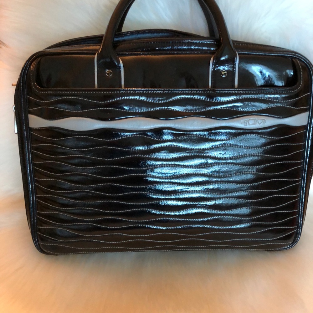 Tumi black, patent, quilted reef case